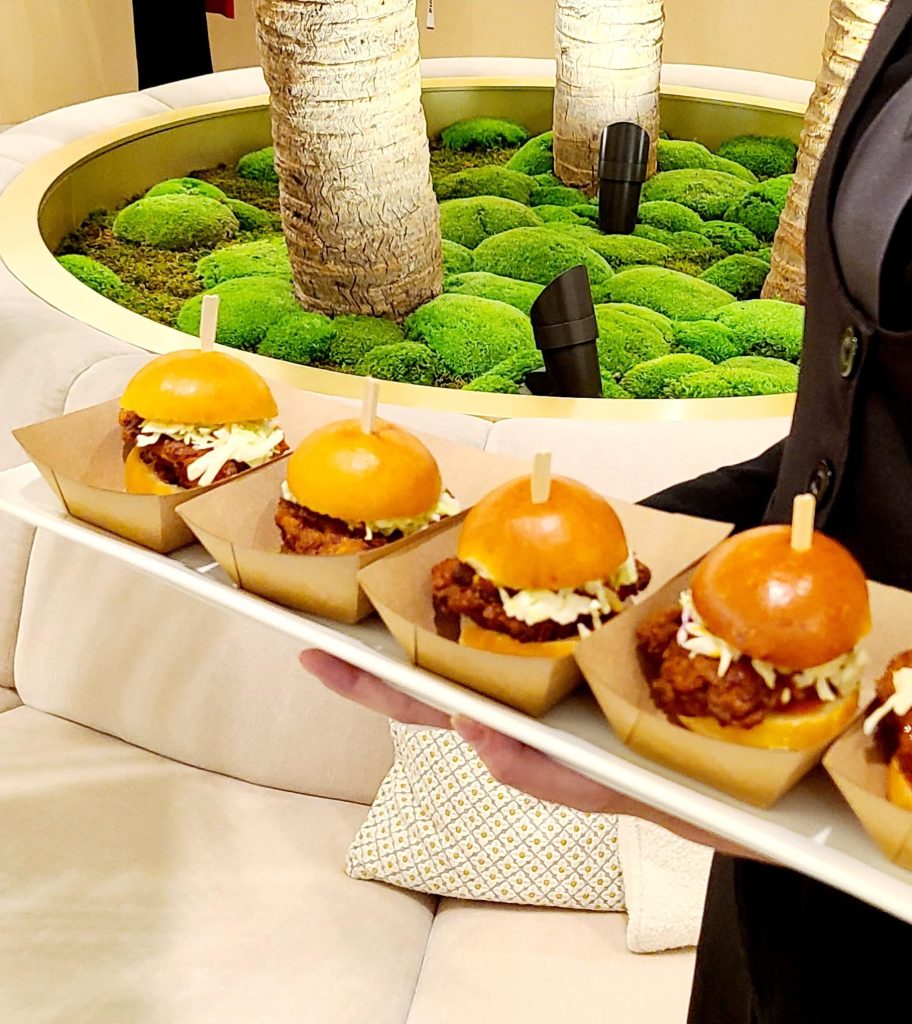 A waiter with 4 zinger burgers